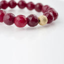 Faceted Ruby with Gold Stardust