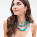 Irregular shaped Turquoise knotted on hand rolled Natural Leather cord