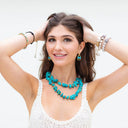 Irregular shaped Turquoise knotted on hand rolled Natural Leather cord