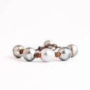 Light Gray Tahitian and White South Sea Pearls knotted on Natural Leather Cord. Pearl Button Closure.