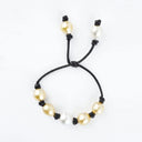 Yellow and White South Sea and Tahitian Pearl Bracelet on Black Leather Cord with adjustable sliding closure.