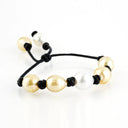 Yellow and White South Sea and Tahitian Pearl Bracelet on Black Leather Cord with adjustable sliding closure.